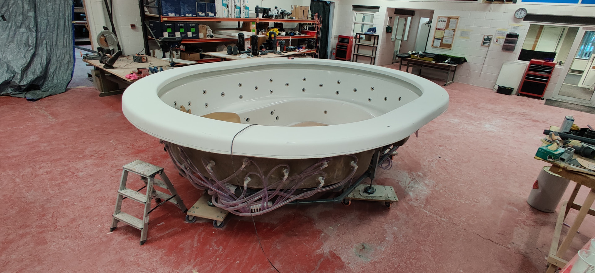 Spa vessel on the jig — jets and service runs set out