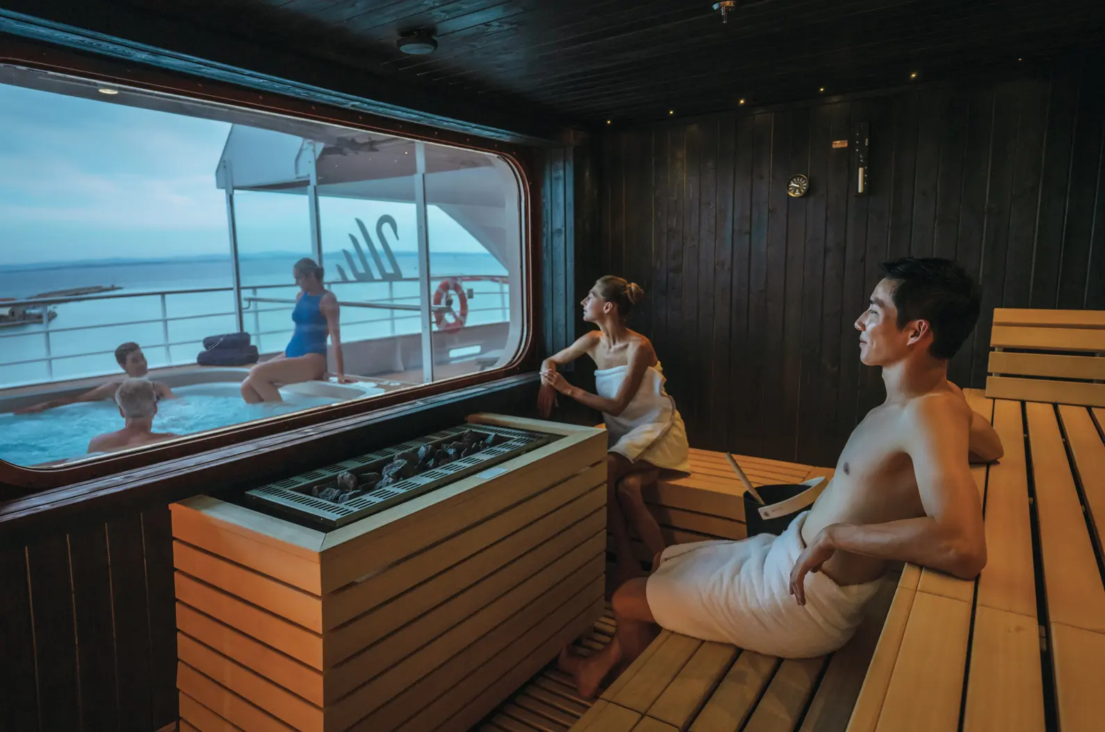 Adjacent sauna and deck spa in service